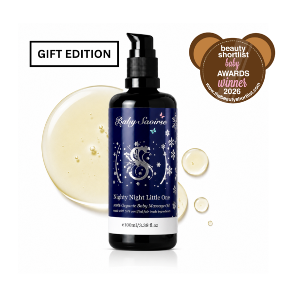 Blue-labeled BabySaoirse Nighty Night Little One organic baby massage oil bottle with surrounding oil droplets and a 'Gift Edition' tag.