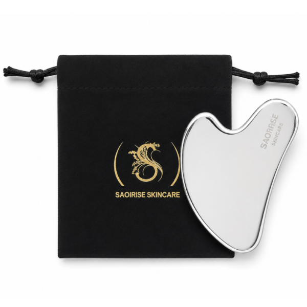 Silver heart-shaped facial massager resting against a black drawstring pouch with the Saoirse Skincare logo in gold wheels.