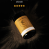 Skincare bottle labeled ‘Dirty Spice’ on a dark powdery surface, with gold stars and two quotes praising the product above and below.